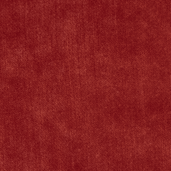 Deep red textured surface with a dense, short pile and subtle tonal variations, displaying a uniform composition under soft, diffused lighting.