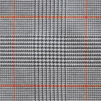 Plaid fabric sample with gray, navy, and white houndstooth check, accented by orange-red grid stitching; includes “formitalia” text.