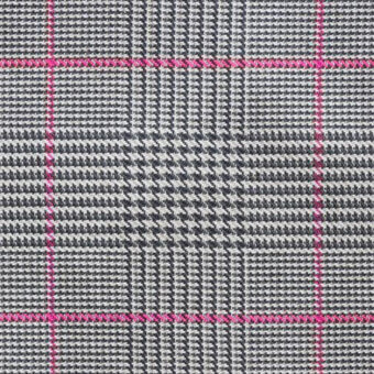 Houndstooth fabric swatch, gray and navy blue, with a bright pink grid stitching pattern and a tightly woven, textured surface.