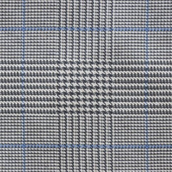 Plaid fabric texture features gray, white, and blue houndstooth check interwoven with a fine grid pattern; labeled “formitalia galles fumo & greggio – azzurro lines.”