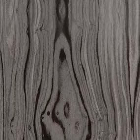Wood veneer sample, medium-brown tone, swirling grain pattern with glossy finish, displaying dynamic texture against a light gray backdrop.