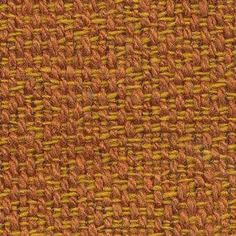 Woven fabric texture, ochre and burnt orange tones, complex basketweave pattern with raised nubby yarns and subtle text detail.