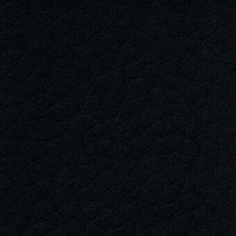 Black PVC fabric texture with a dense, irregular weave and matte finish; sample labeled “33 saturno pvc > black 33 016a”.