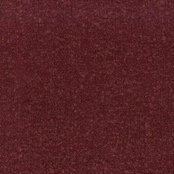 Dense fabric texture in vino color, exhibiting a granulated, uneven surface with matte finish and no discernible pattern.