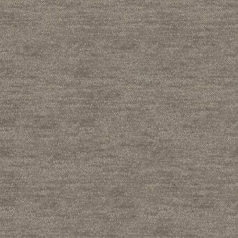 Woven fabric sample in muted taupe with heathered texture and dark gray flecks, displaying a dense, matte weave and visible label details.
