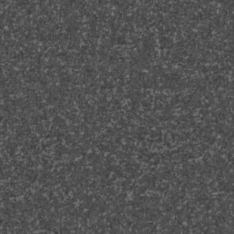 Dense gray granular texture with uneven matte surface, displaying a random distribution of finely ground components and consistent tonal variation.