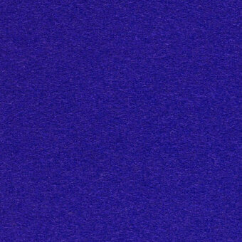 Indigo textile surface with a granular texture and saturated deep blue color, displaying a uniform, dense short-pile composition.