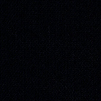 Dark granular texture with scattered light specks, resembling a night sky, featuring tonal variations and a uniform studio lighting setup.