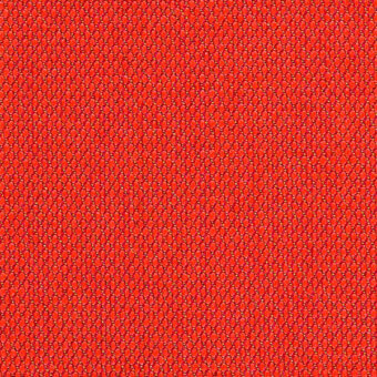 Red woven textile texture with repeating circular pattern, matte finish, and subtle recessed centers; Kvadrat Steelcut Trio fabric sample.
