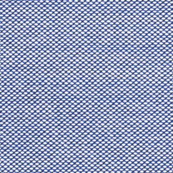 Dense woven textile with repeating circular perforations on a deep blue background, displaying a structured, textured surface.