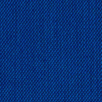 Kvadrat Steelcut Trio texture, deep blue, dense circular perforations create a uniform matte finish and subtle three-dimensional pattern.