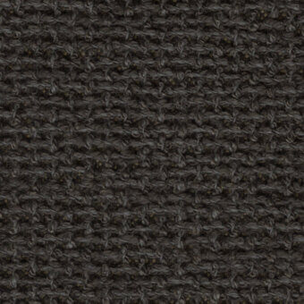 Dark gray woven textile with a dense, irregular pattern and nubby texture, displaying subtle tonal variations and a uniform weave.