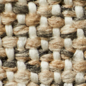 Woven fabric texture with creamy white, warm tan, and dark gray yarns in an irregular, linear pattern with knotted intersections.