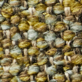 Gold, brown, and gray-blue tweed fabric texture with a heathered, nubby weave and off-white warp threads for a rustic appearance.