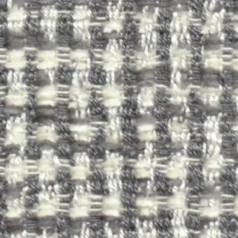 Woven tweed fabric, off-white and charcoal gray, dense irregular weave with nubby texture; “nicotrend 668 013” pattern sample.