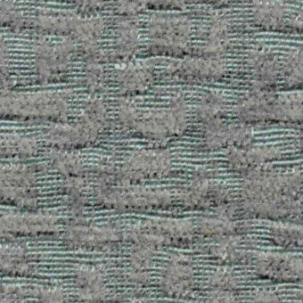 Woven fabric texture, gray and teal-green, dense rectangular grid pattern with nubby surface; Horm Nuance V2, Nicotrend 683 010.