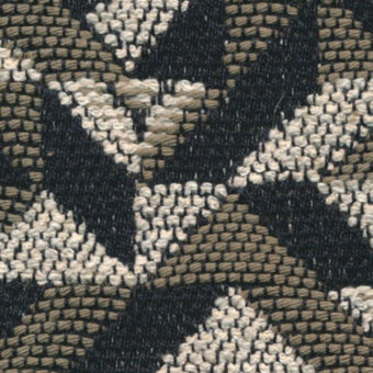 Woven texture sample featuring dark charcoal, beige, and off-white irregular diamond blocks; labeled “horm > nuance v2 (exclusive) > pattern torrilana 697 028”.
