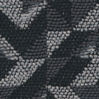 Woven gray fabric texture features repeating geometric starburst motifs in white and light gray, with subtle vertical ribbing.