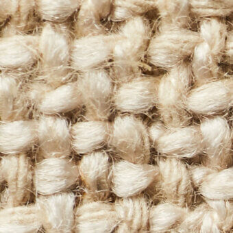 Marigold textured fabric with looped pile construction, showing creamy yellow tones and a fuzzy, matte finish from thick yarn fibers.