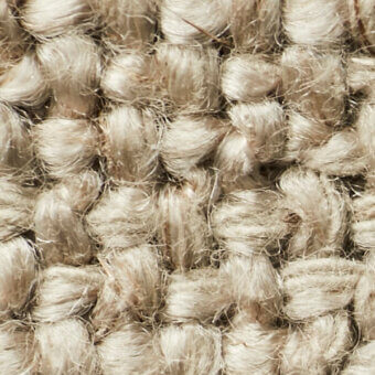Woven textile sample, marigold color, dense nubby surface with grid pattern and tonal variations, coarse fiber texture for upholstery.