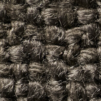 Dark brown synthetic looped pile texture, dense shag carpet with uniform grain and subtle marbling, neutral background.