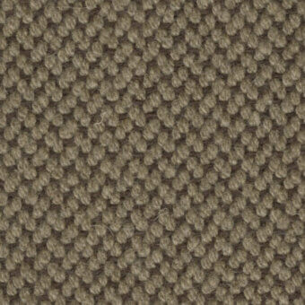 Brown nubby texture with repeating circular pattern and linear strands, featuring subtle beige variations and a matte, woven finish.
