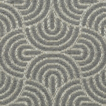 Woven fabric texture, gray and off-white, features repeating curvilinear motifs in a looping, floral-wave pattern with subtle sheen.