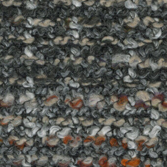 Textured fabric swatch in charcoal gray with beige, tan, and orange accents displays a looped, knotted fiber pattern.