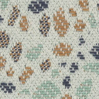 Geometric textile pattern in navy, orange, and sage on off-white, featuring a dense weave and irregular diamond-hexagonal shapes; torrilana 812 036.