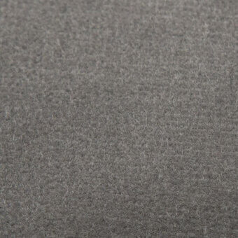 Gray velvet fabric texture with short pile and uniform surface, displaying subtle shade variations and a diffused, felt-like appearance.