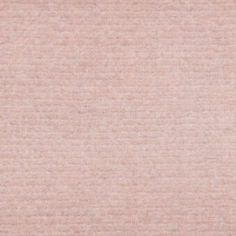 Velvet fabric texture in blush pink, displaying a dense, short pile and subtle tonal variations for a soft, luxurious appearance.