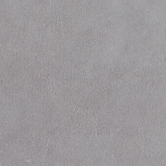 Gray granular texture with a soft, velvety appearance and dispersed particles, displaying a consistent matte finish under even lighting.
