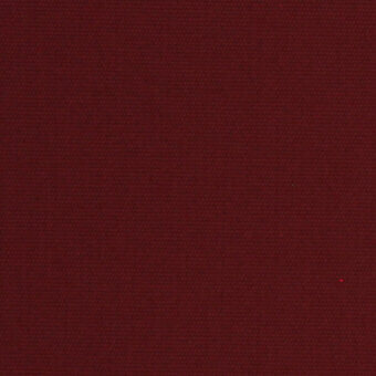 Burgundy fabric swatch displaying a tight, uniform weave and granular texture, with muted red and brown tones under diffused lighting.