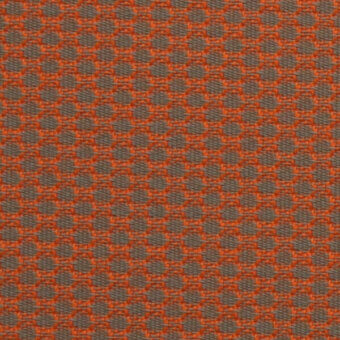 Textile sample with repeating orange circles on a brownish-gray grid, displaying a tight weave and textured surface; labeled “horm > outdoor flukso clouds openair > 409 openair.”