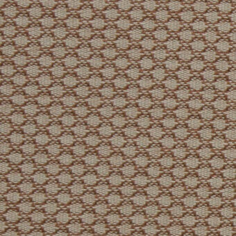 Brown open-weave textile with repeating geometric circles and ovals, durable texture, porous surface, outdoor application, Horm brand.