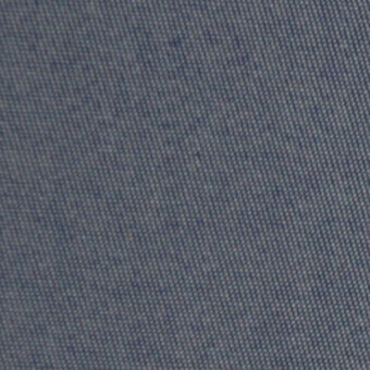 Woven fabric texture in gray-blue with subtle irregular weave, matte finish, and faint imprinted text pattern; durable textile sample.