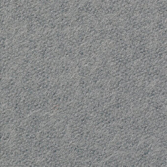 Textured fabric sample in medium gray with embedded text “horm > vescom lani 7060 32”, displaying a dense, matte, slightly mottled fiber surface.