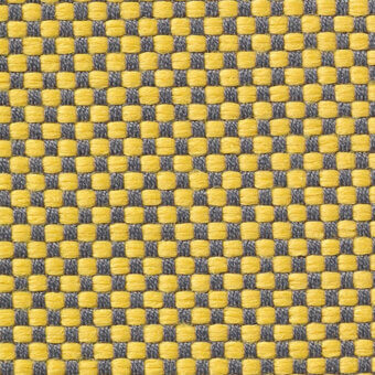 Woven checkerboard textile featuring mustard yellow and dark gray, with a matte finish and regular grid pattern; Vescom Samar 7052 fabric sample.