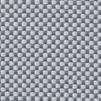 Geometric textile sample in gray and light blue features a dense, repeating square and rectangular weave with “vescom samar 7052 39” text.