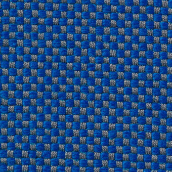 Blue and gray woven fabric texture with a square grid pattern, displaying “vescom samar 7052 51” text, studio lighting.
