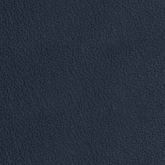 Mottled texture in blue-gray tones with dispersed dark speckles, presenting a dense, irregular pattern across a flat, diffused surface.