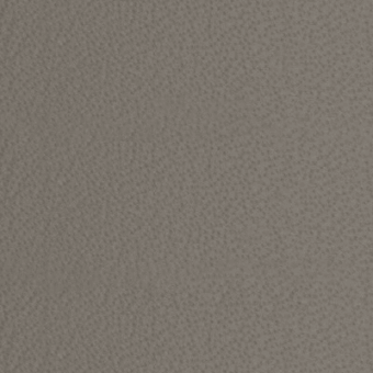 Textured fabric swatch in gray-brown with a dense, irregular pattern; diffused lighting highlights the tactile surface, labeled “kobe > col.6218.”