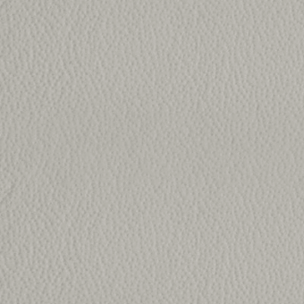 Gray fabric swatch with dense, irregular weave texture and subtle bumps; label reads “kobe > col.6334”, studio lighting.