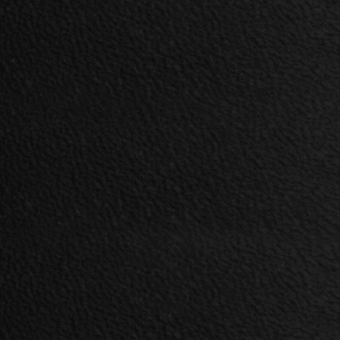 Black stucco texture, granular surface with tonal variations, matte finish, material sample, “kobe > col.nero” designation in corner.