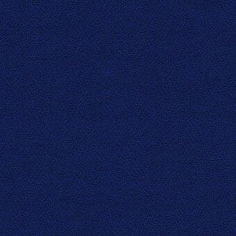 Blue woven fabric texture displaying a granular, speckled pattern with a dense composition and a matte, slightly rough surface.