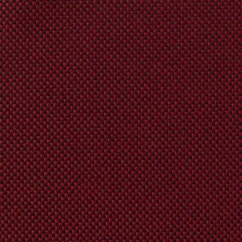 Red woven fabric sample displaying a dense basketweave texture with geometric square and rectangular patterns, matte finish.