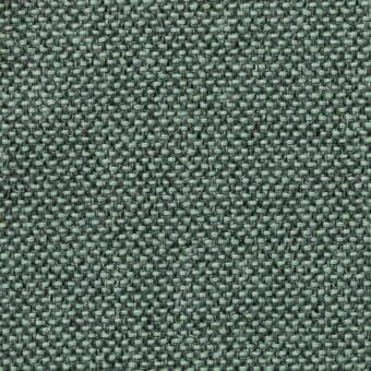 Woven fabric with muted sage green and dark gray geometric pattern, dense texture, matte finish, and visible thread variations.