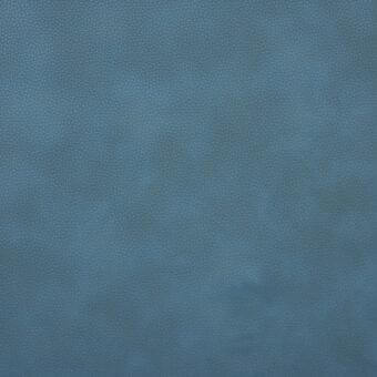 Blue-green textured fabric sample displaying a granular, dotted pattern and matte finish with tonal variations and a distressed appearance.