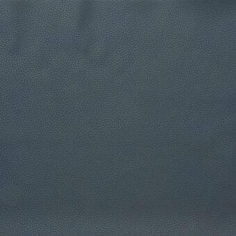Coated textile fabric sample, cool gray-blue color, dense repeating circular pattern, matte finish, taut surface, neutral studio background.
