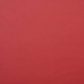 Red textured fabric sample with a uniform dot pattern and matte finish, appearing smooth and consistent in color and likely synthetic.